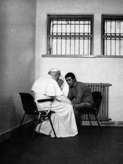
Pope John Paul II talks with his would-be assassin Mehmet Ali Agca in Agca's prison cell in Rome in 1983.
 (File/Associated Press / The Spokesman-Review)