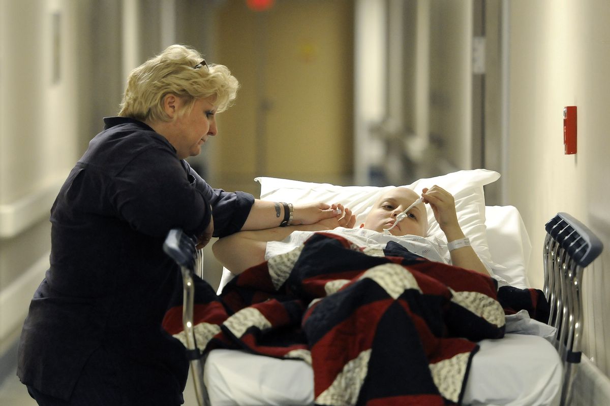 Carissa Outen and her mother, Gwen Ashcraft, wait  at Providence Sacred Heart Children’s Hospital in May. 
