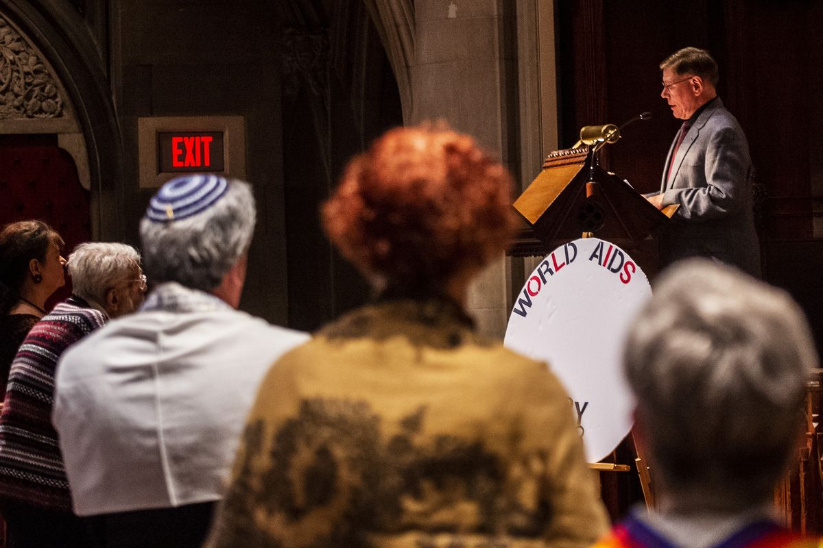 Bill Buchanan, who worked for the study from 1988 until he retired in 2022, gives the welcoming speech for the annual World Aids Day commemoration on Nov. 28, 2018, at Heinz Memorial Chapel in Oakland, Pittsburgh. (Michael M. Santiago/Pittsburgh Post-Gazette/TNS)