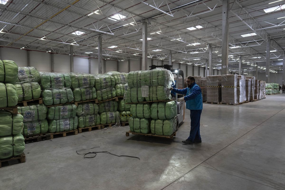 UNHCR staff load a truck with supplies for Ukraine in an aid warehouse at Rzeszow airport, in Rzeszow, southeastern Poland, Wednesday, March 16, 2022.  (Petros Giannakouris)