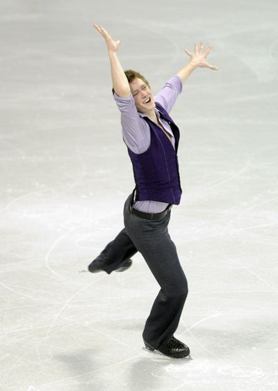 Jeremy Abbott was all smiles and in first after completing all his jumps in the men’s short program. He'll compete in Sunday's free skate. (Colin Mulvany / The Spokesman-Review)