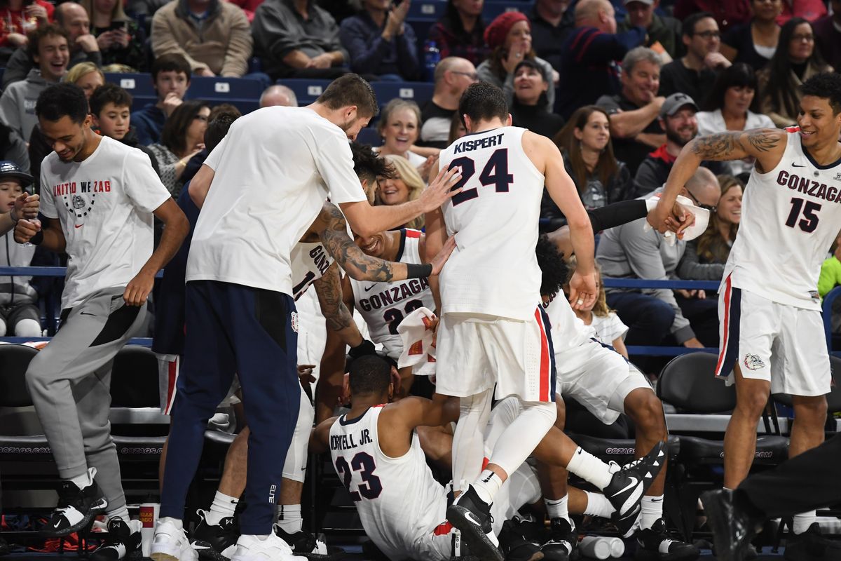 Gonzaga bench falls all over themselves after teammate Alex Martin tried a 3-point against Denver, Friday, Dec. 21, 2018, in the McCarthey Athletic Center. (Dan Pelle / The Spokesman-Review)