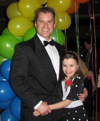 
David and Madison Jesse pose for a photo at the third annual Liberty Lake Kiwanis Father-Daughter Dance.
 (Frank Cruz-Aedo / The Spokesman-Review)