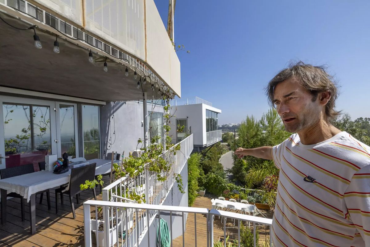 Sascha Jovanovic explains his situation on the deck of his Los Angeles home. (Allen J. Schaben/Los Angeles Times/TNS)