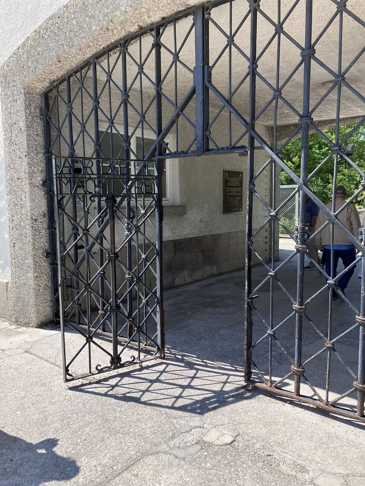 “Arbeit Macht Frei” atop the front gate of Konzentrationslager Dachau in Munich, Germany in May 2025.  (Rob Kauder / The Spokesman-Review)
