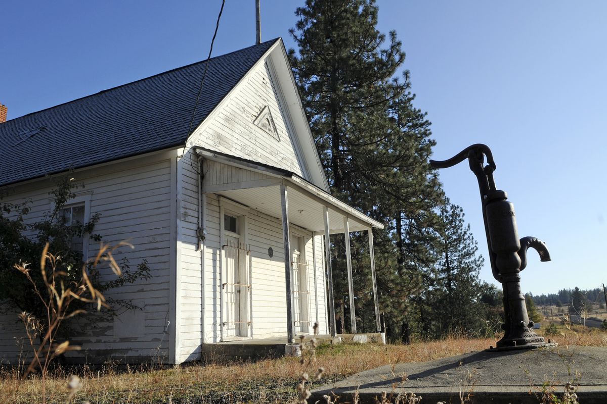 The original Central School District No. 49 one-room schoolhouse, with a working hand pump, sits at the corner of Richey and Four Mound roads in Spokane County. (PHOTOS BY DAN PELLE)