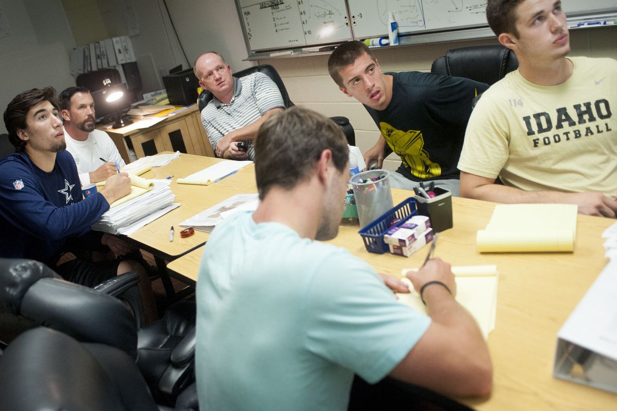 Idaho coach Paul Petrino takes in another film session with his quarterbacks. Back in the day, Petrino would wait for game film to arrive on the bus. (Tyler Tjomsland)