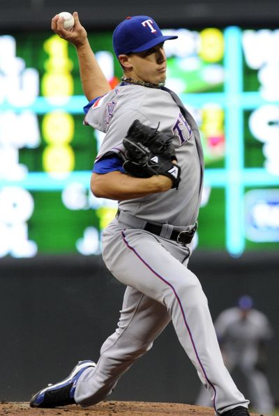 Derek Holland allowed four hits in his third career shutout as Texas beat A’s. (Associated Press)
