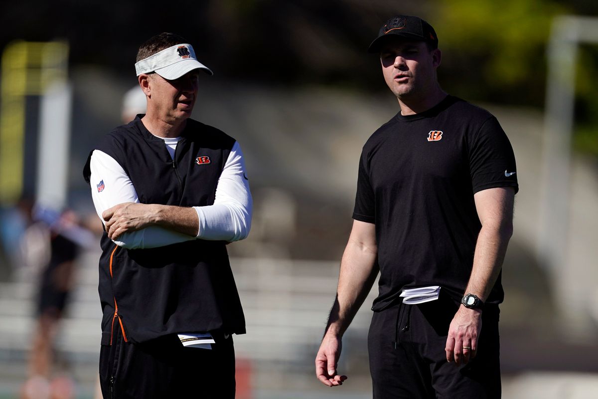 Cincinnati Bengals head coach Zac Taylor, right, talks to defensive coordinator Lou Anarumo during NFL football practice Wednesday, Feb. 9, 2022, in Los Angeles. The Cincinnati Bengals play the Los Angeles Rams in the Super Bowl Feb. 13.  (Marcio Jose Sanchez)