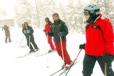 
Silver Mountain ski instructor Diane LeBlanc, right, talks with Jim Gregory, second from right, of Cherry Hill, N.J., and Blaine Miller, third from right, of Maine, Thursday. 
 (Jesse Tinsley / The Spokesman-Review)
