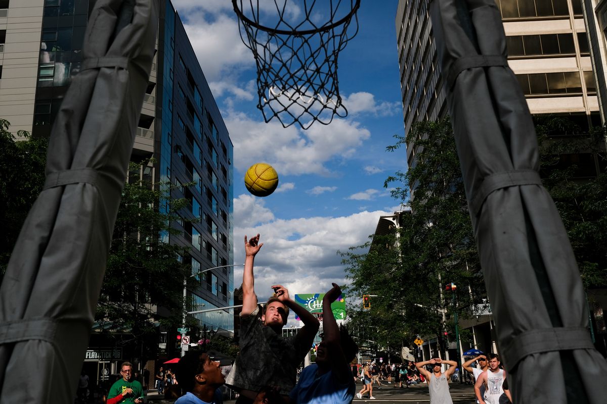 Ethan Bard with the Whidbey Wizards takes a shot against members of Fresh Never Benched during Hoopfest on Saturday in Spokane. (Tyler Tjomsland/The Spokesman-Review)