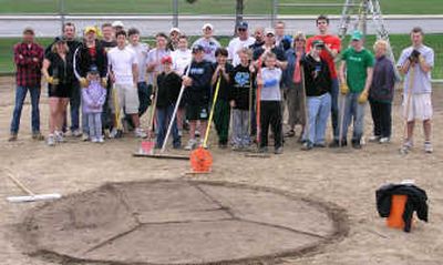 
Volunteers gather on the infield after turning a neglected lot into a baseball field for use by East Side Little League. Jacob Amini organized the effort for his Eagle Scout project.Courtesy Jacob Amini
 (Courtesy Jacob Amini / The Spokesman-Review)