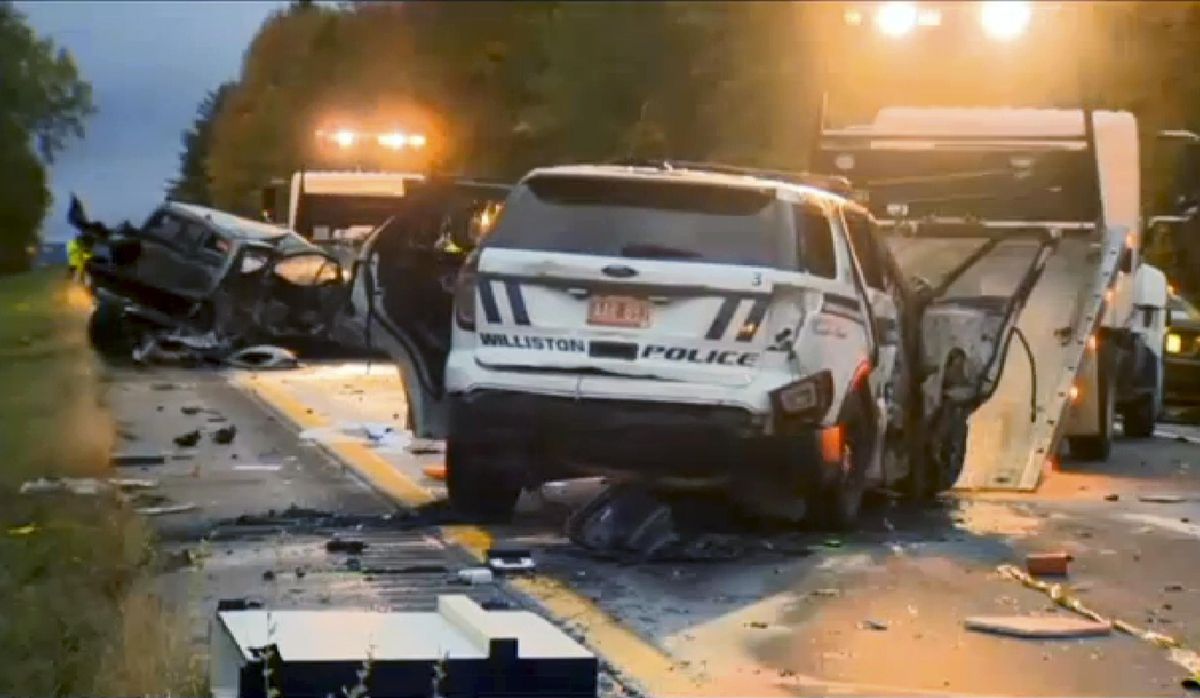 In this still image from video provided by WCAX-TV, workers remove vehicles from Interstate 89 early Sunday in Williston, Vt., after a wrong-way driver caused a crash just before midnight that killed multiple people, before stealing a police cruiser, striking several vehicles and injuring several  others. (WCAX-TV via Associated Press)
