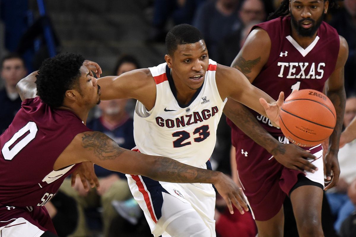 Gonzaga Bulldogs guard Zach Norvell Jr. (23) heads downcourt as Texas Southern Tigers forward Devocio Butler (0) reaches for the ball during the first half of a college basketball game, Sat., Nov. 10, 2018, in the McCarthey Athletic Center. (Colin Mulvany / The Spokesman-Review)