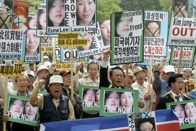 Protesters shout slogans during a rally Thursday  in Seoul, South Korea, held to coincide with the trial in North Korea  of two American journalists.  (Associated Press / The Spokesman-Review)