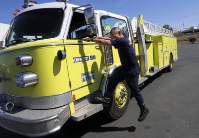 Spokane Firefighter Rex Peterson prepares to shuttle a ’70s vintage backup ladder truck up to Station 18 from the city’s fire maintenance facility next to Spokane Community College. colinm@spokesman.com (Colin Mulvany colinm@spokesman.com / The Spokesman-Review)