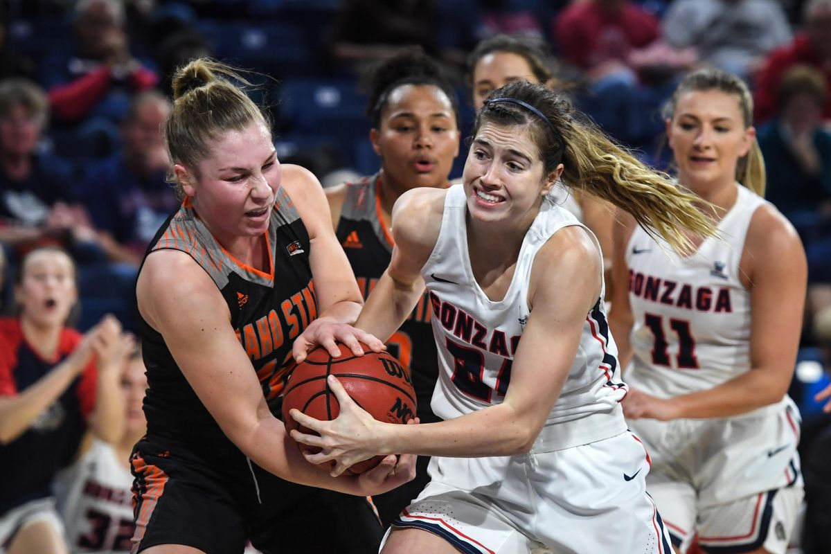Gonzaga guard Katie Campbell (24) battles Idaho State guard Callie Bourne for a loose ball, Tuesday, Nov. 13, 2018, in the McCarthey Athletic Center. (Dan Pelle / The Spokesman-Review)