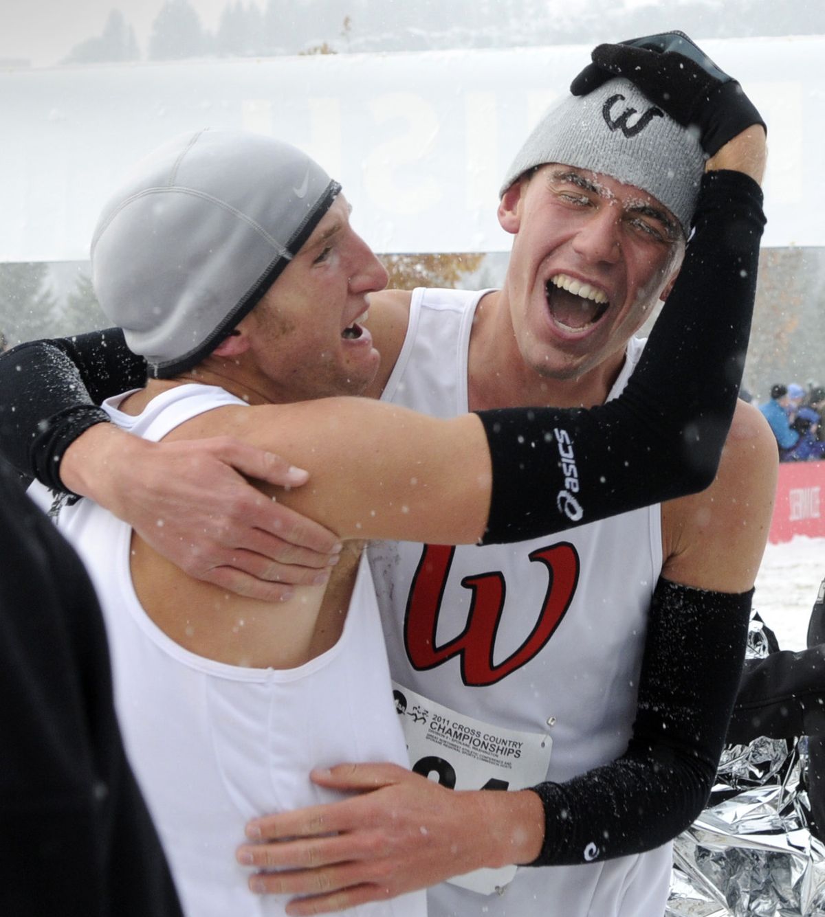 Western State’s Ryan Haebe, left, the NCAA Division II cross country champion, celebrates with teammate Trevor Blackman on Saturday. (Dan Pelle)