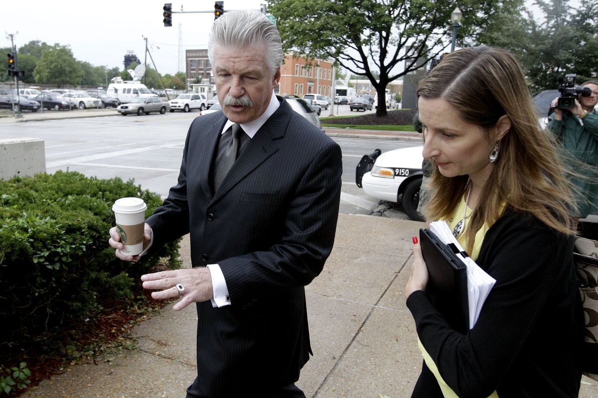 Will County States Attorney James Glasgow enters court for jury instructions in the murder trial of former Bolingbrook police officer Drew Peterson, Wednesday, Sept. 5, 2012, in Joliet, Ill. Jurors are expected to begin deliberating on allegations the former suburban Chicago police officer murdered his third wife. (M. Green / Associated Press)