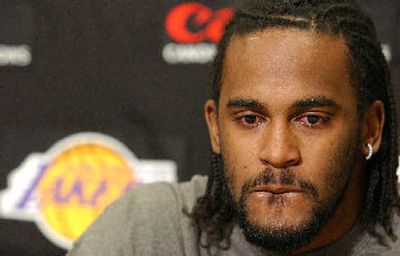 
Ronny Turiaf tries to hold back tears after answering questions about his heart condition. 
 (Associated Press / The Spokesman-Review)