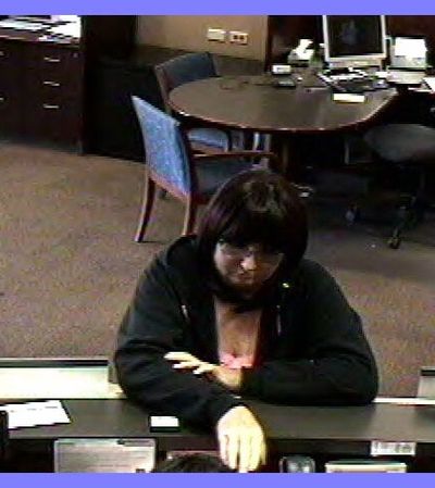 This image shows a woman robbing a Chase bank on West Francis Avenue in Spokane on Monday. See more photos at spokesman.
