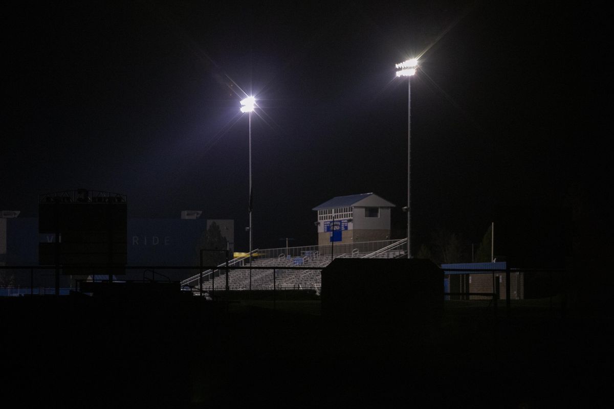 The football field at Coeur d’Alene High School is lit up during an event honoring senior athletes on Friday, April 10, 2020. (Cheryl Nichols / For The Spokesman-Review)