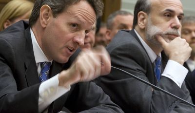 Treasury Secretary Timothy Geithner, left, with Federal Reserve Chairman Ben Bernanke, gestures while testifying Tuesday,  before a House Financial Services Committee hearing on AIG.  (Associated Press / The Spokesman-Review)