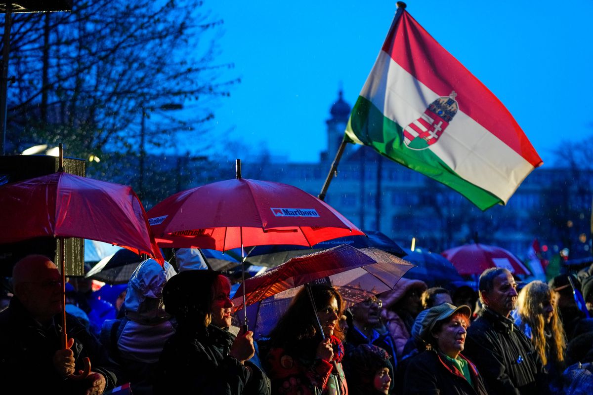Supporters of United For Hungary, the six-party opposition coalition, chant the national anthem during the final electoral rally in Budapest, Hungary, Saturday, April 2, 2022, ahead of Sunday's election. Hungary's nationalist prime minister, Viktor Orban, seeks a fourth straight term in office, a coalition of opposition parties are framing the Sunday election as a referendum on Hungary's future in the West.  (Petr David Josek)