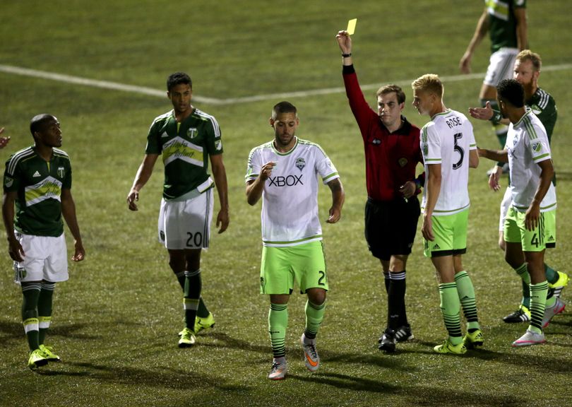 n this photo taken Tuesday, June 16, 2015, Seattle Sounders FC's forward Clint Dempsey (2) appears to rip up referee Daniel Radford's notebook after Radford issued a red card to teammate Michael Ariza while playing the Portland Timbers in a U.S. Open Cup soccer match at Starfire Stadium in Tukwila, Wash. Dempsey was issued a red card his actions. (Erika Schultz / Seattle Times)