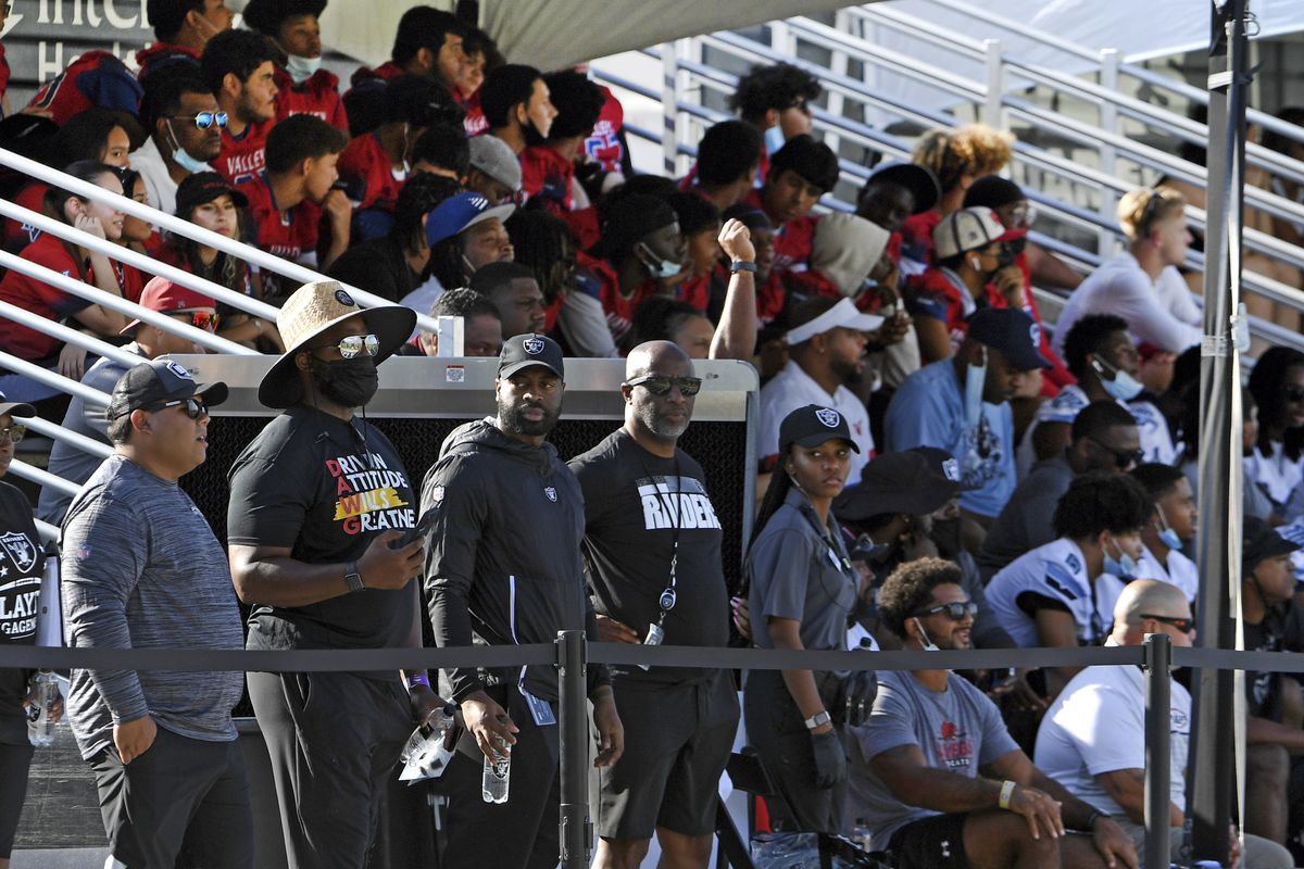 FILE - In this July 31, 2021file photo Las Vegas Raiders fans watch the team during an NFL football practice in Henderson, Nev. Vaccine verification is becoming a coronavirus fighting front in Nevada. Las Vegas