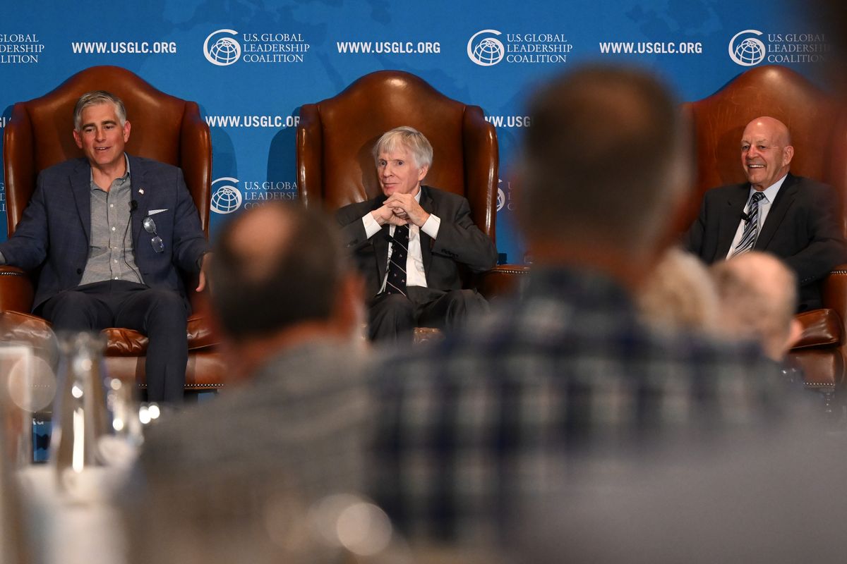Rep. Michael Baumgartner, left, smiles while fielding questions with former Ambassador Ryan Crocker, center, and retired Vice Admiral Mike LeFever, right, during a discussion on Eastern Washington’s role in American foreign policy on Wednesday at the Davenport in Spokane. (Tyler Tjomsland/The Spokesman-Review)