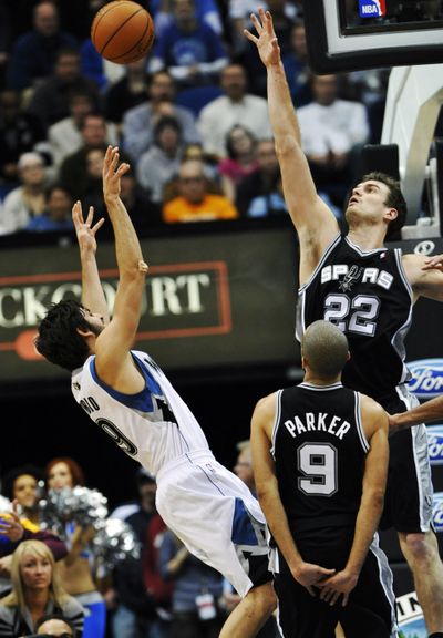 San Antonio’s Tiago Splitter tries to block a shot by Minnesota’s Ricky Rubio in second half of Friday’s game at Minneapolis. (Associated Press)