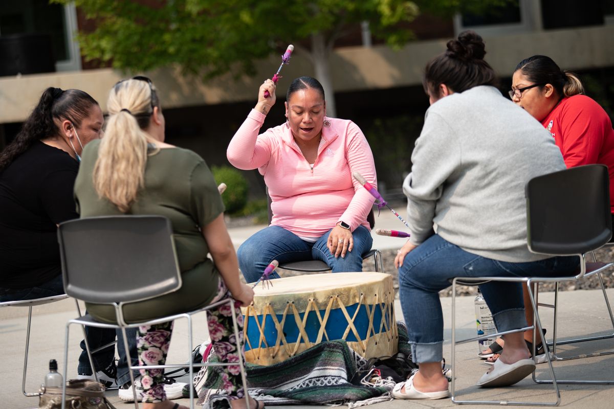 The all-female Rose Creek Singers drum group perform during the Whistalks Way Community Celebration held at Spokane Falls Community College on Friday, Aug. 20, 2021 to recognize the successful renaming of the former Fort George Wright Drive to Whistalks Way after the indigenous female warrior Whist-alks. The Spokane Tribe, Native Project, the Native American Alliance for Policy and Action and Community Colleges of Spokan collaborated for the event that ealso celebrated the achievements of modern-day native and indigenous women warriors in Eastern Washington.  (Libby Kamrowski/ THE SPOKESMAN-R)