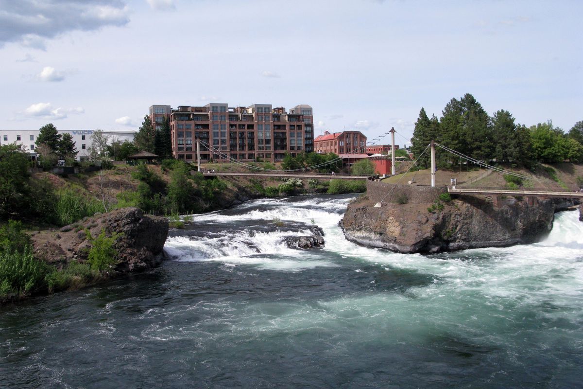 The Spokane Flour Mill, center right, can be seen on the north bank of the Spokane River. Glover Mansion Events LLC, operator of Chateau Rive At The Flour Mill, has completed the buy-out of the venue. (Jesse Tinsley / The Spokesman-Review)