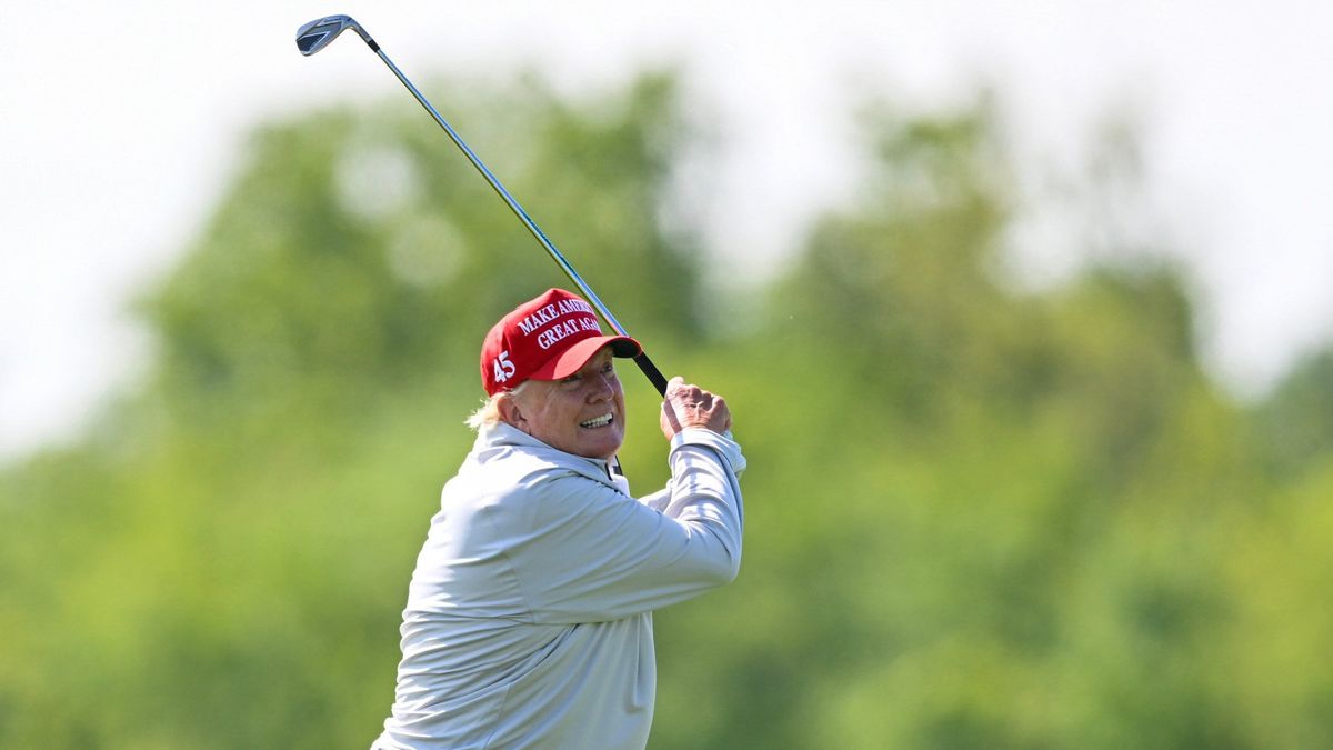 Former president Donald Trump hits the ball while playing in the LIV Golf Pro-Am at Trump National Golf Club in May. MUST CREDIT: Washington Post photo by John McDonnell.  (John McDonnell/The Washington Post)