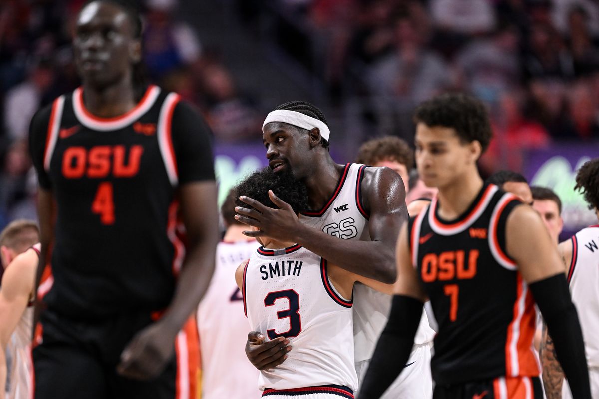 Gonzaga Bulldogs forward Graham Ike (15) hugs guard Braeden Smith (3) late during the second half of a WCC Tournament men’s semifinal basketball game against the Oregon State Beavers on Monday, Mar 9, 2026, at the Orleans Arena in Las Vegas, Nev. The Gonzaga Bulldogs won the game 65-56.  (Tyler Tjomsland/The Spokesman-Review)