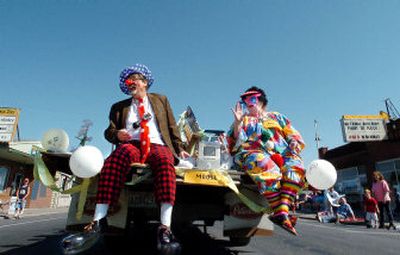 
Fred and Giggles the clowns from the Spokane Moose Lodge wave and throw candy to kids along the Hillyard Hi-Jinks Parade route last year.
 (File / The Spokesman-Review)