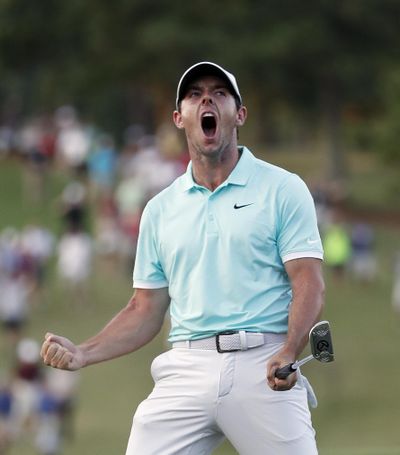 Rory McIlroy reacts after sinking a putt on the fourth hole to win the Tour Championship golf tournament and the FedEx Cup at East Lake Golf Club on Sunday in Atlanta. (John Bazemore / Associated Press)