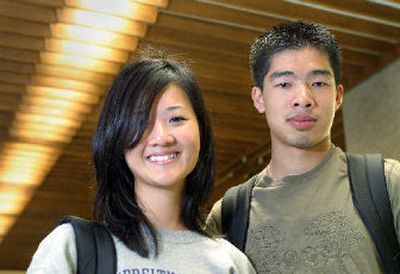 
University of Texas geological sciences senior Thuan Phan, right, and, hydrology senior Kim Nguyen were both recruited for jobs by oil companies. Phan accepted a job with the oilfield services firm of Sclumberger, but Nguyen opted to go with an environmental consulting firm. 
 (Associated Press / The Spokesman-Review)