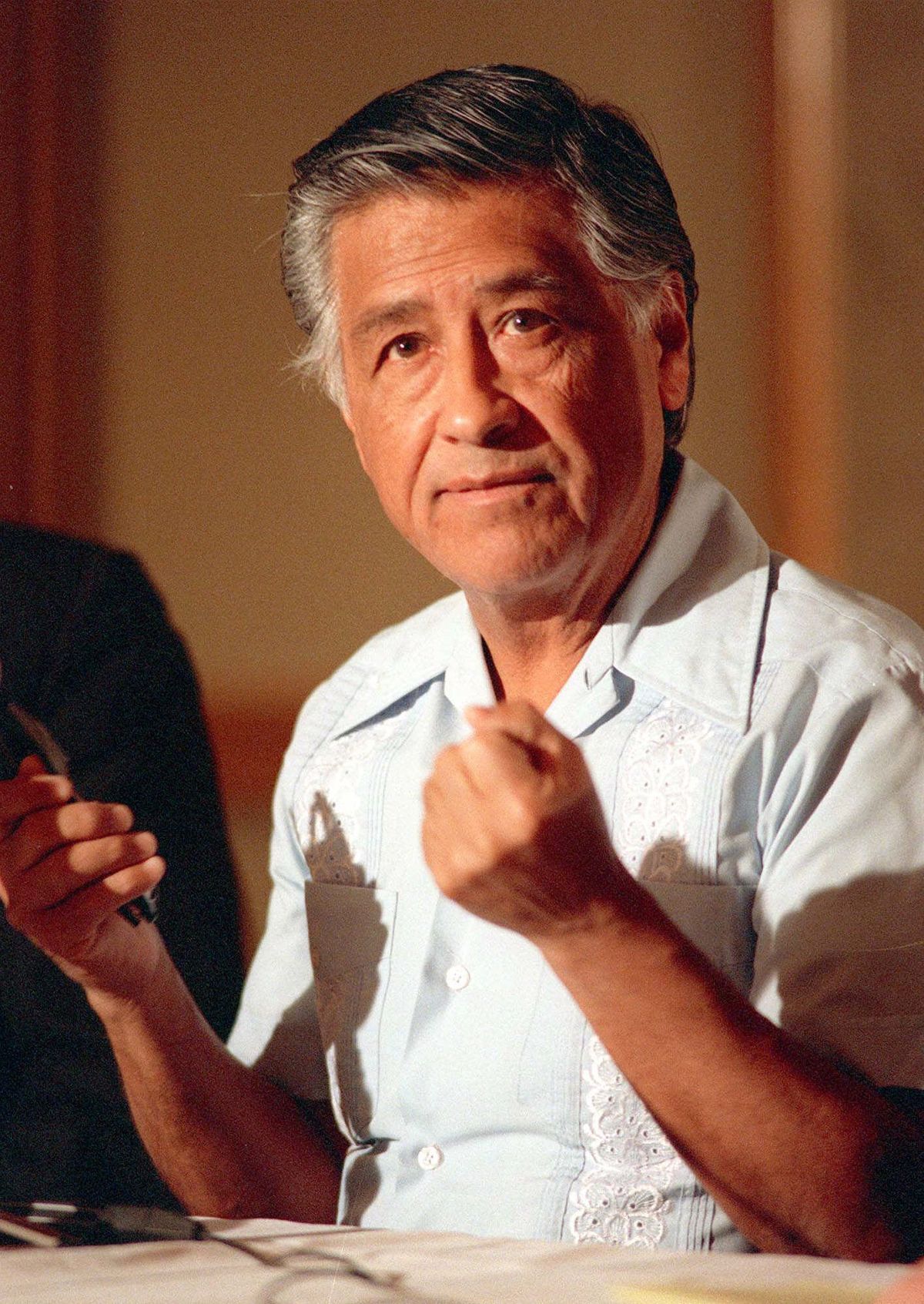 FILE - In this March 8, 1989 file photo, Cesar Chavez gestures as he speaks during a news conference in Los Angeles. Today, the foothills of the Tehachapi mountains continue to house the United Farm Workers of America headquarters and memorials to Chavez, though farmworkers no longer live there. President Obama is designating parts of the property as a national monument and visiting the site on Monday, a move seen as likely to shore up support from Hispanic and progressive voters just five weeks before the election. (Alan Greth / Associated Press)