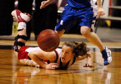 Sprague-Harrington's Roni Jo Mielke dives for a loose ball during the Falcons' fifth-place State B win over Toutle Lake at the Arena on Saturday. 
 (Kathryn Stevens / The Spokesman-Review)