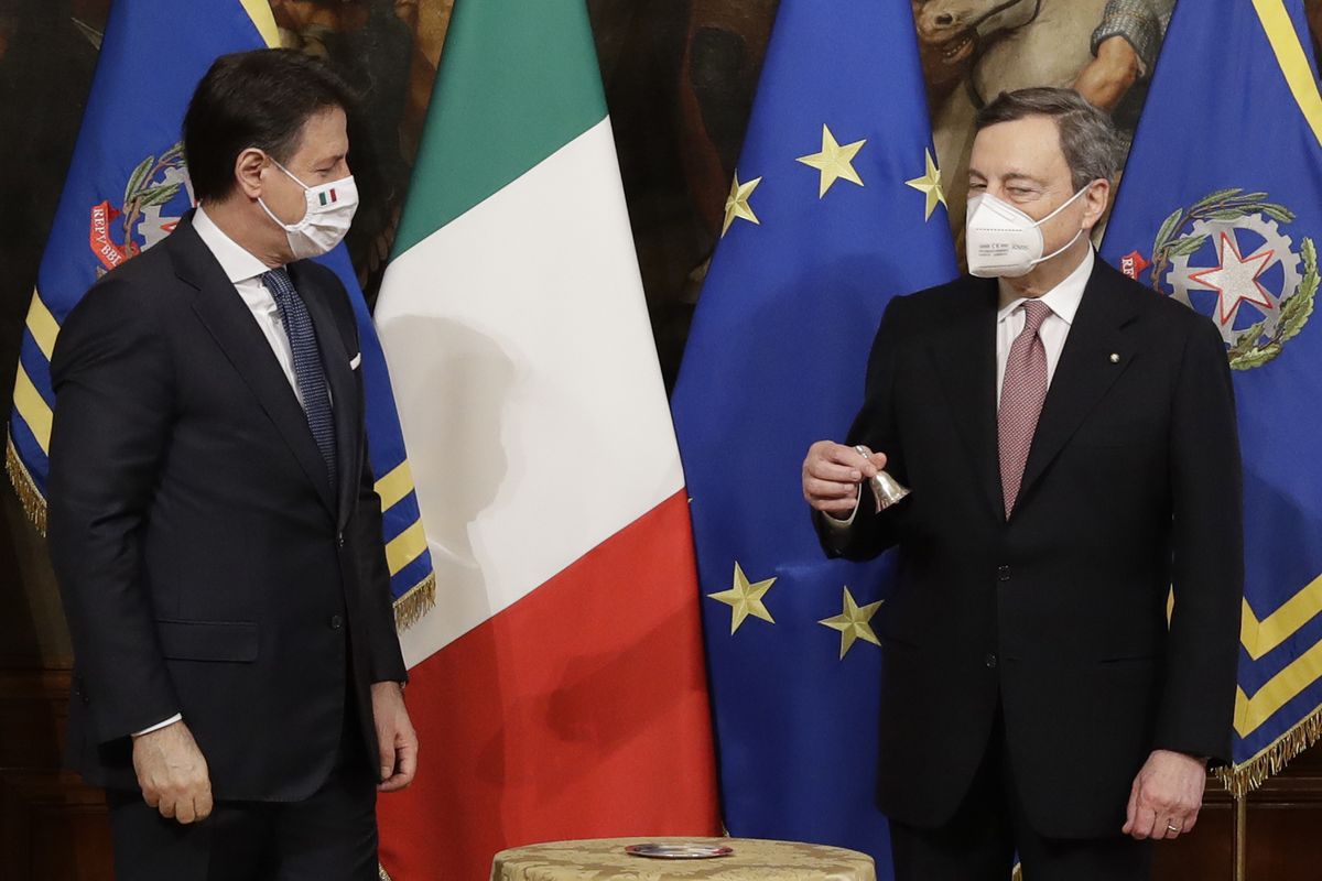 Italian outgoing Premier Giuseppe Conte handed over the cabinet minister bell to new Premier Mario Draghi, during the handover ceremony at Chigi Palace Premier