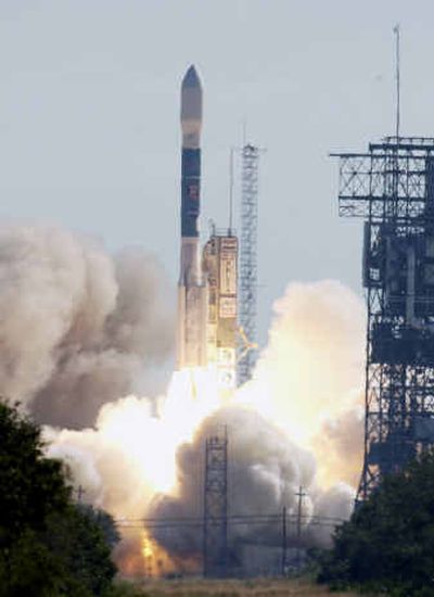 
A Delta II rocket carrying NASA's Swift gamma ray spacecraft lifts off from Launch Complex 17 Saturday at Kennedy Space Center in Florida.
 (Associated Press / The Spokesman-Review)