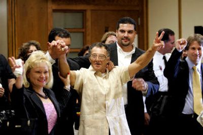
Luis Diaz, 67, waves to reporters, photographers and supporters after he was released from prison and his rape convictions thrown out Wednesday in Miami. 
 (Associated Press / The Spokesman-Review)