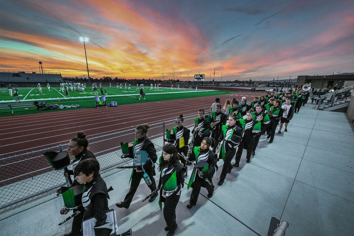 Ridgeline High School band and color guard prepare to take the field for their Homecoming football game halftime show, Friday, Oct. 7, 2022, at Ridgeline High School.  (COLIN MULVANY/THE SPOKESMAN-REVIEW)