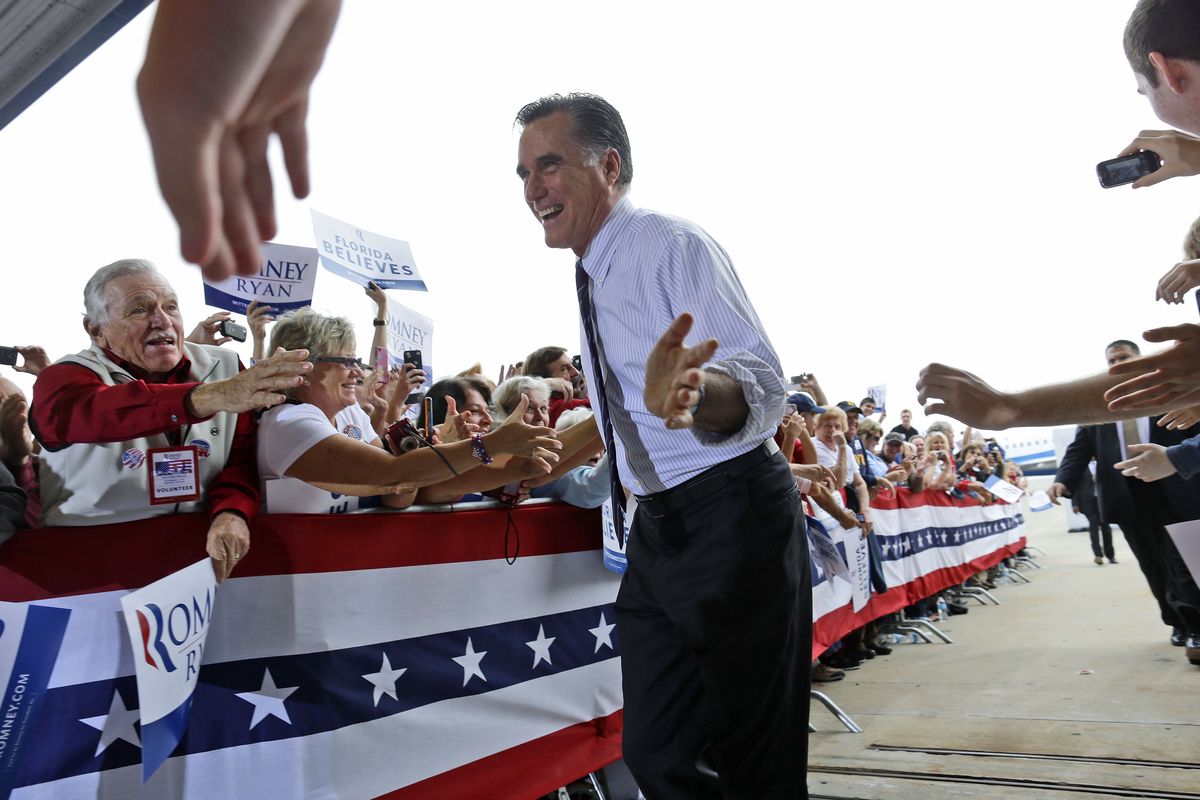 Republican presidential candidate, former Massachusetts Gov. Mitt Romney gestures as he greets supporters as he arrives at a Florida campaign rally at Orlando Sanford International Airport, in Sanford, Fla., Monday, Nov. 5, 2012. (Charles Dharapak / Associated Press)