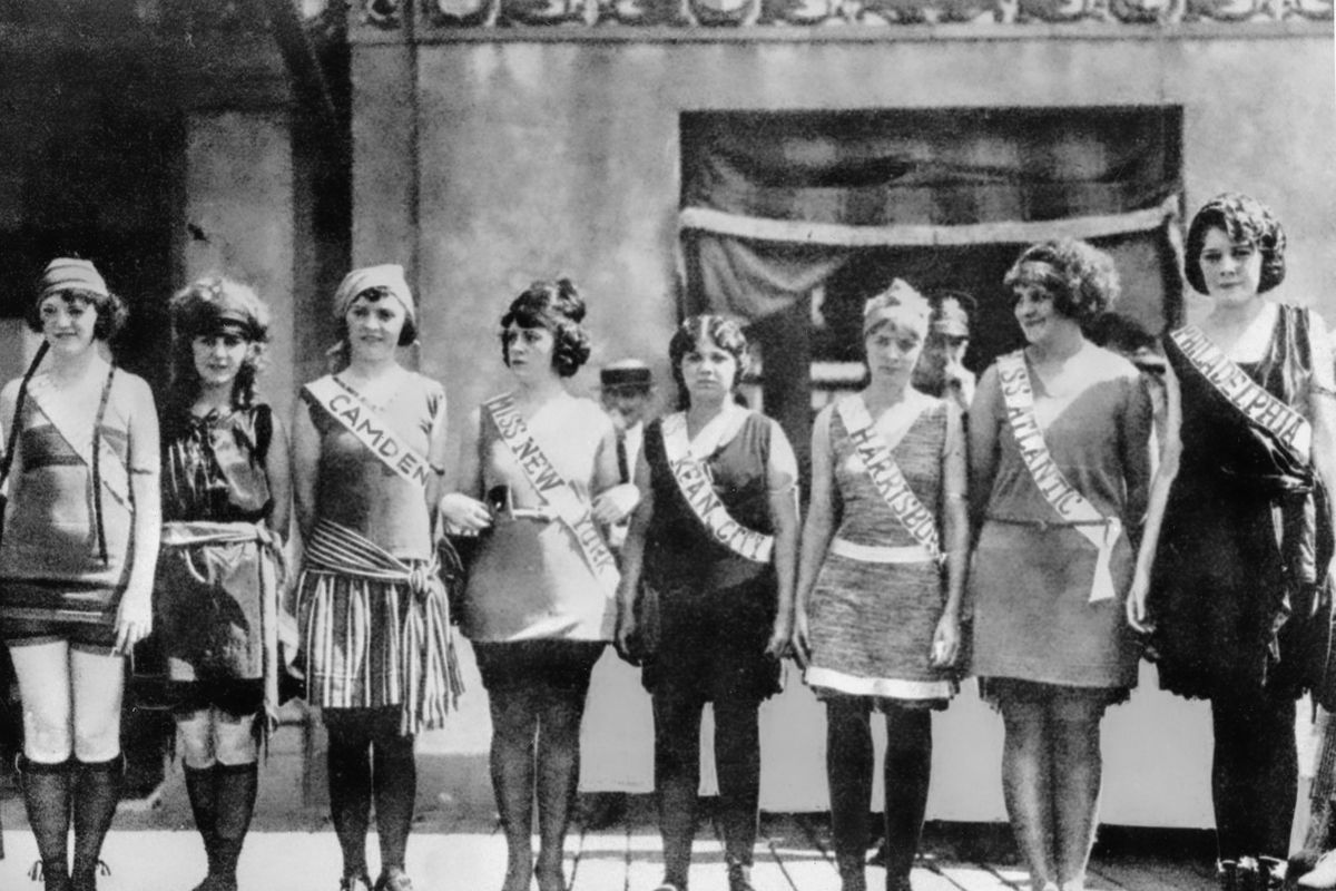 FILE - Contestants in the first Miss America pageant line up for the judges in Atlantic City, N.J., in September 1921. The competition is marking its 100th anniversary on Thursday, Dec. 16, 2021, having managed to maintain a complicated spot in American culture with a questionable relevancy.  (STF)
