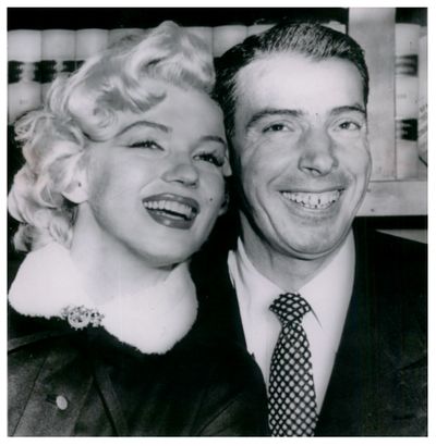 Joe DiMaggio, retired N.Y. Yankees center fielder, is pictured with Marilyn Monroe.  (Cowles Publishing)