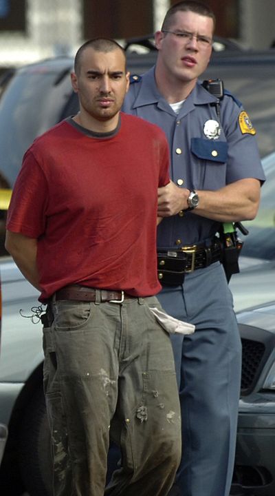 A Washington State Patrol trooper leads shooter Isaac Zamora to jail in Mount Vernon, Wash., in 2008.  (File Associated Press)