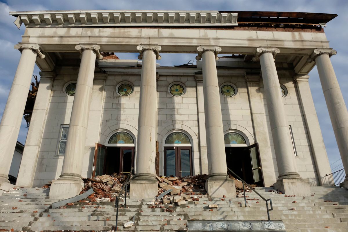 The damaged facade of the First United Methodist Church is seen on Jan. 9, 2022, in Mayfield, Ky. The century-old church has long been an anchor in the Kentucky town of about 10,000 residents, holding countless worship services, weddings, funerals and baptisms. That was before a deadly tornado swept through Mayfield in December, tearing off the church